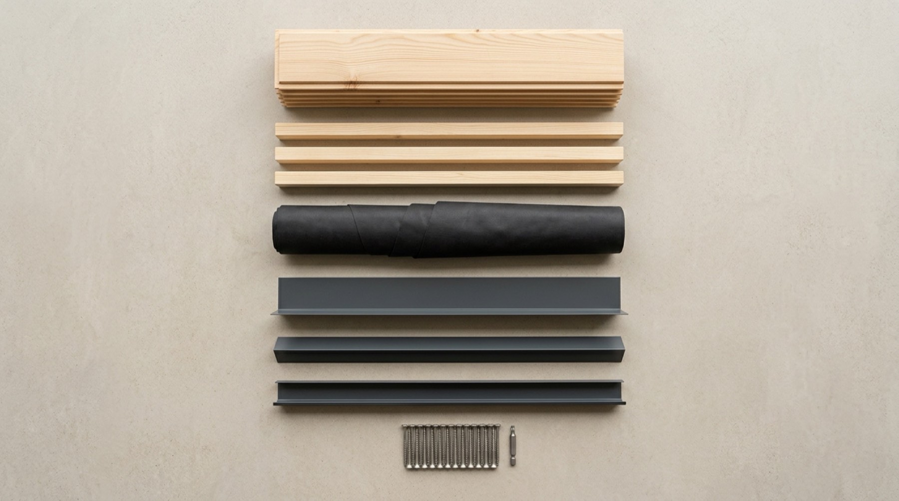 Boards, battens, a roll of membrane, three aluminium profiles and a row of screws laid out side by side